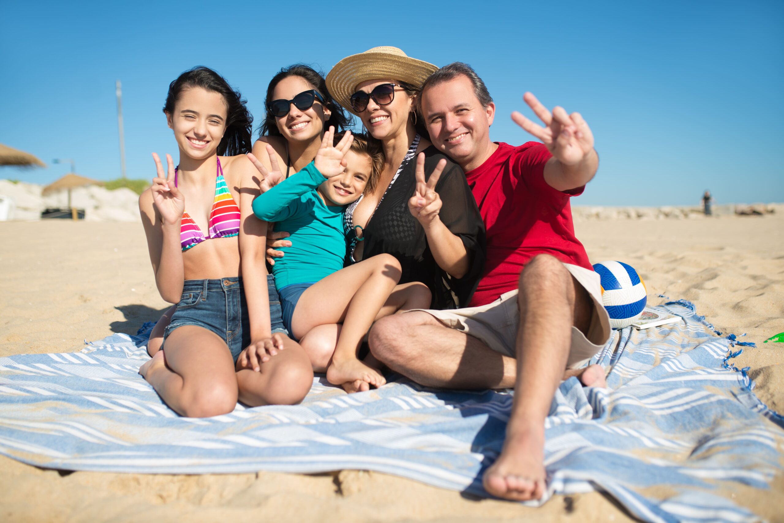 portrait smiling family beach (1)